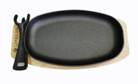 Gryde i støbejern oval med træunderlag