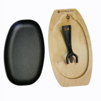 Gryde i støbejern oval med træunderlag