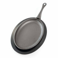 Napoleon gjutjärnspanna med plastunderlägg